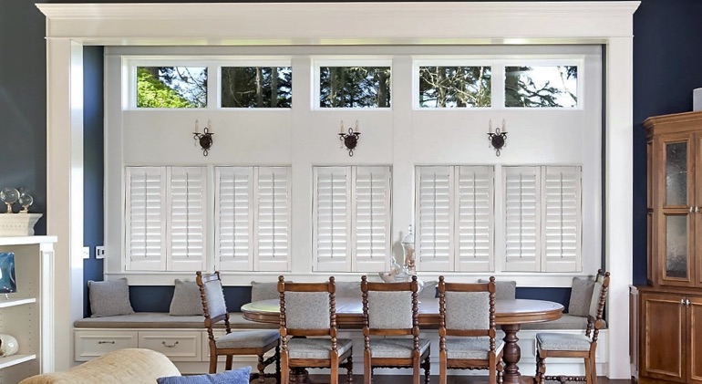 Southern California great room with white plantation shutters.